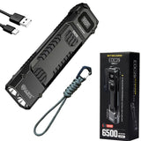 Black flat flashlight with lanyard, USB cable, and Nitecore packaging on a white background